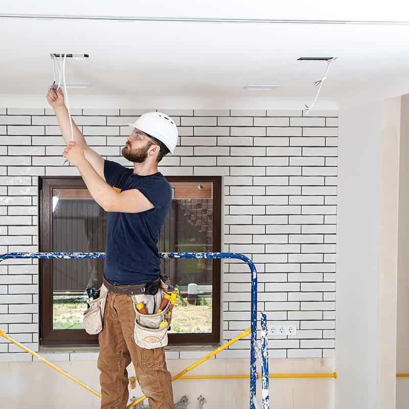 professional-overalls-with-tools-background-repair-site-home-renovation-concept